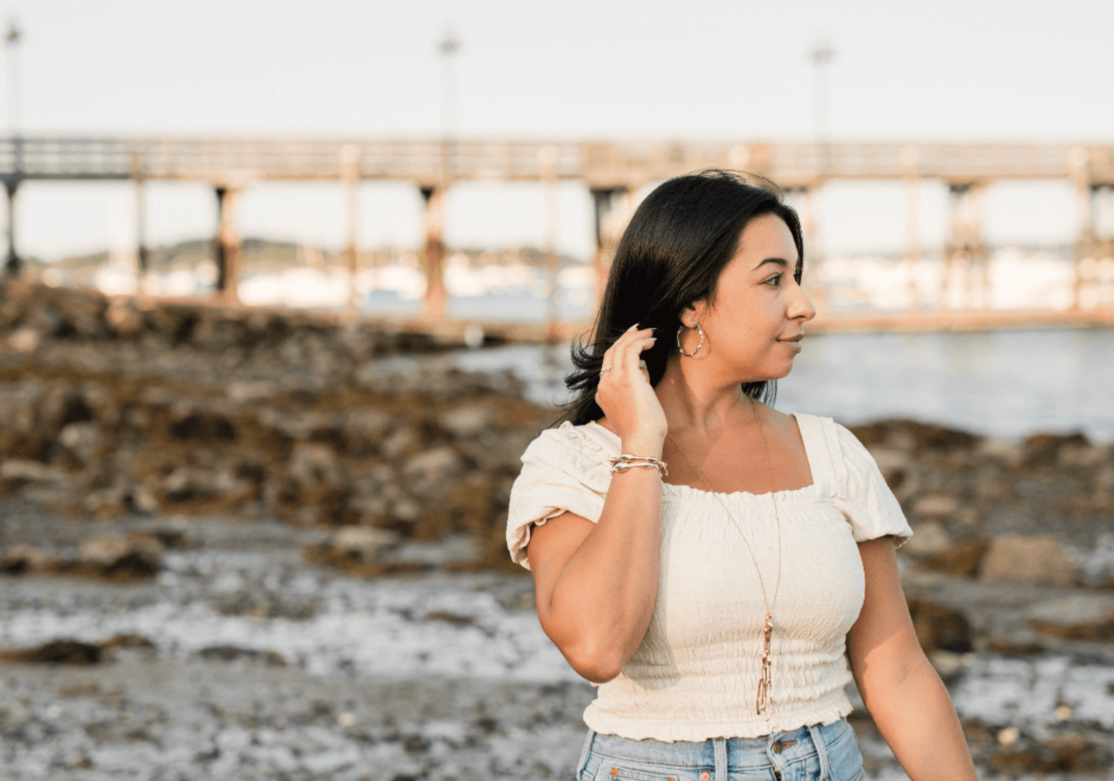 woman wearing seaweed jewelry at low tide