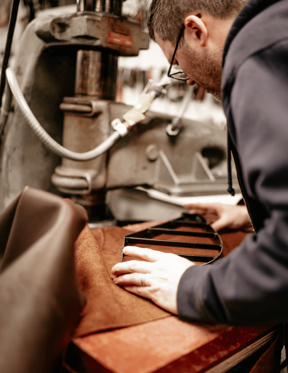 man placing die on leather