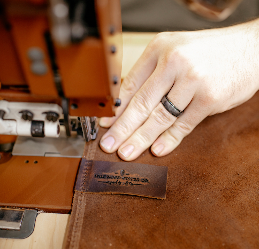 label getting sewn on bag