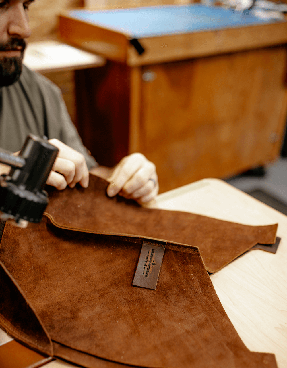 leather bag getting sewn