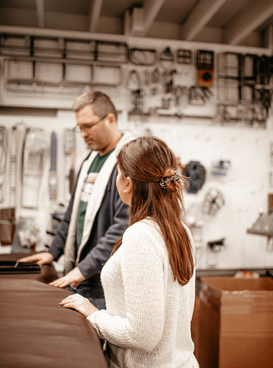 woman talking to a man about leather