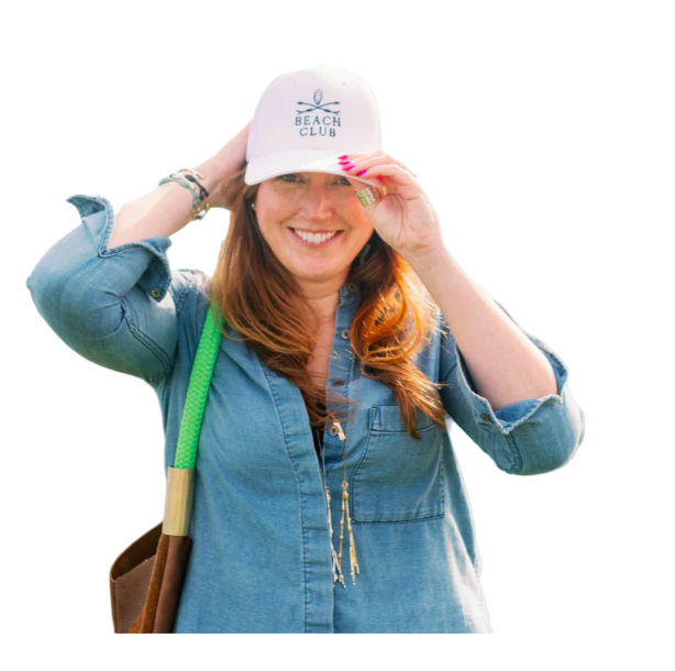 woman wearing a white beach club hat