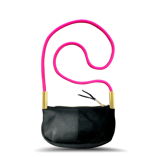 black leather zip crossbody bag with neon pink dock line