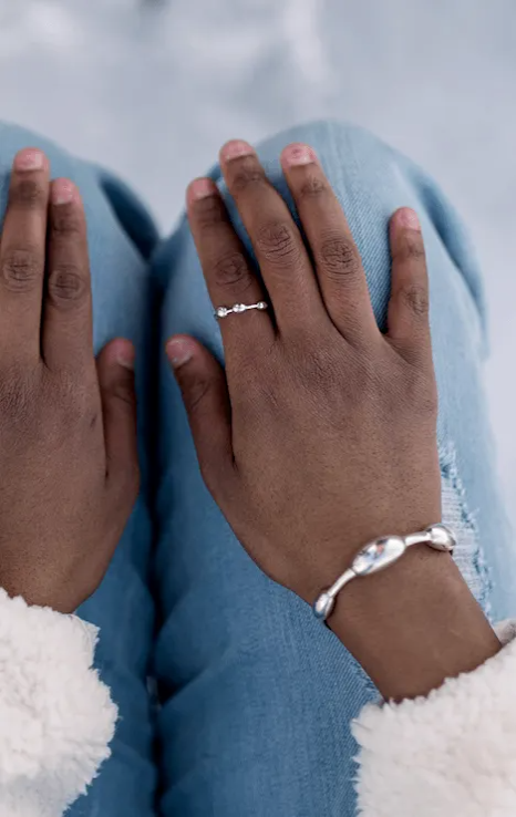 woman wearing a silver seaweed bracelet and ring