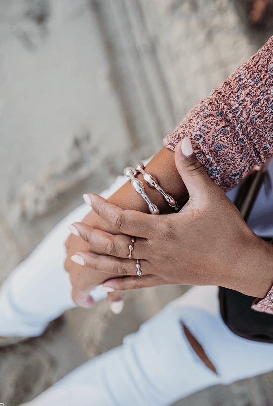 Woman wearing seaweed bracelets and rings