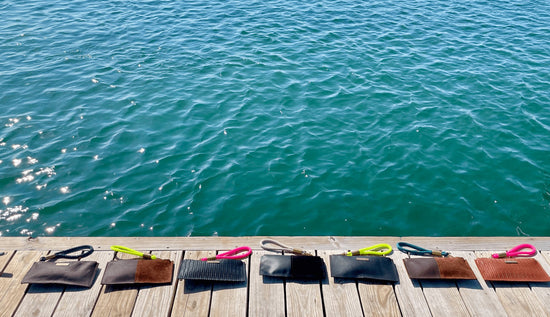 leather clutches on a dock
