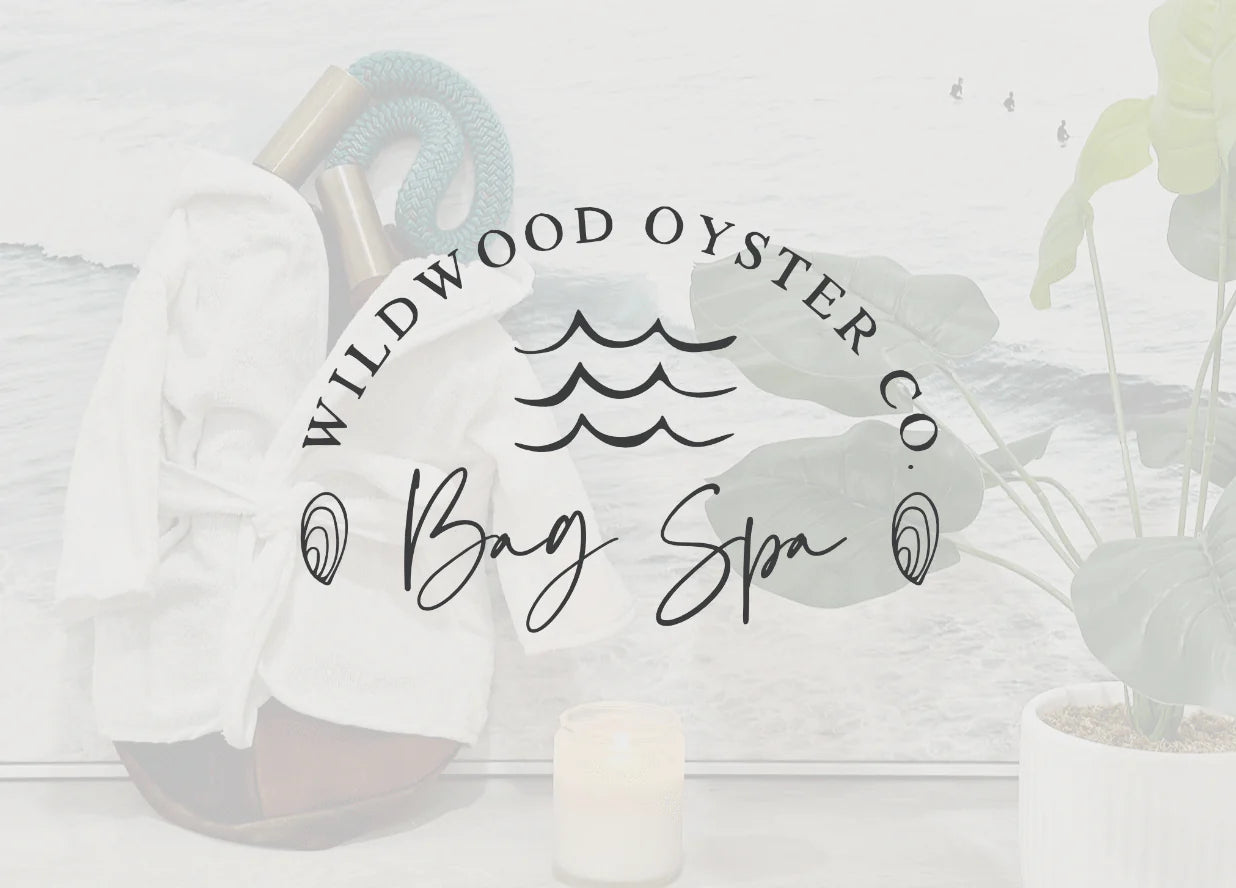 "Wildwood Oyster Co. Bag Spa" across photo of brown tote in white robe