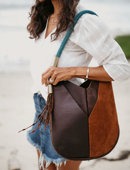 woman wearing brown leather large tote bag