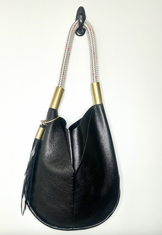 black metallic purse with gold dockline