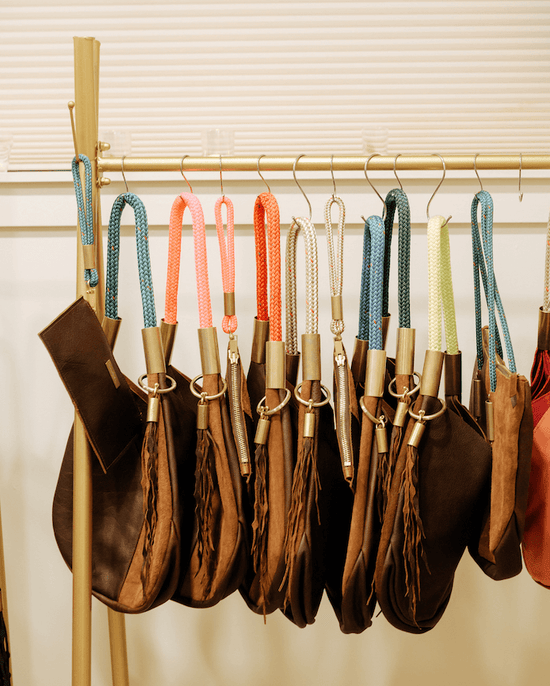 a rack with bags hanging on it