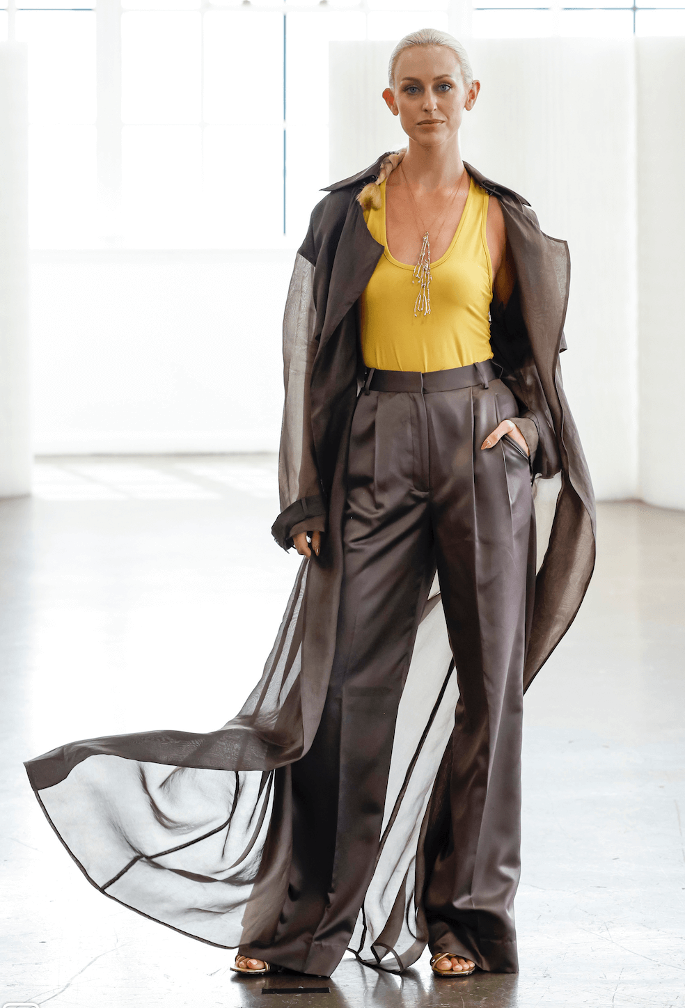 woman wearing a seaweed necklace and gauzy duster
