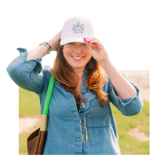 woman wearing a white beach club hat