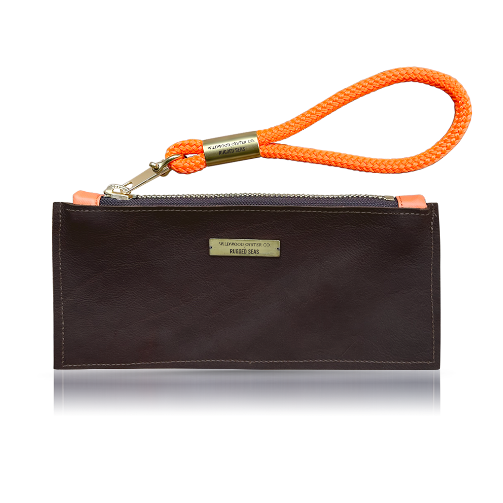 rugged seas brown leather clutch with neon orange wristlet