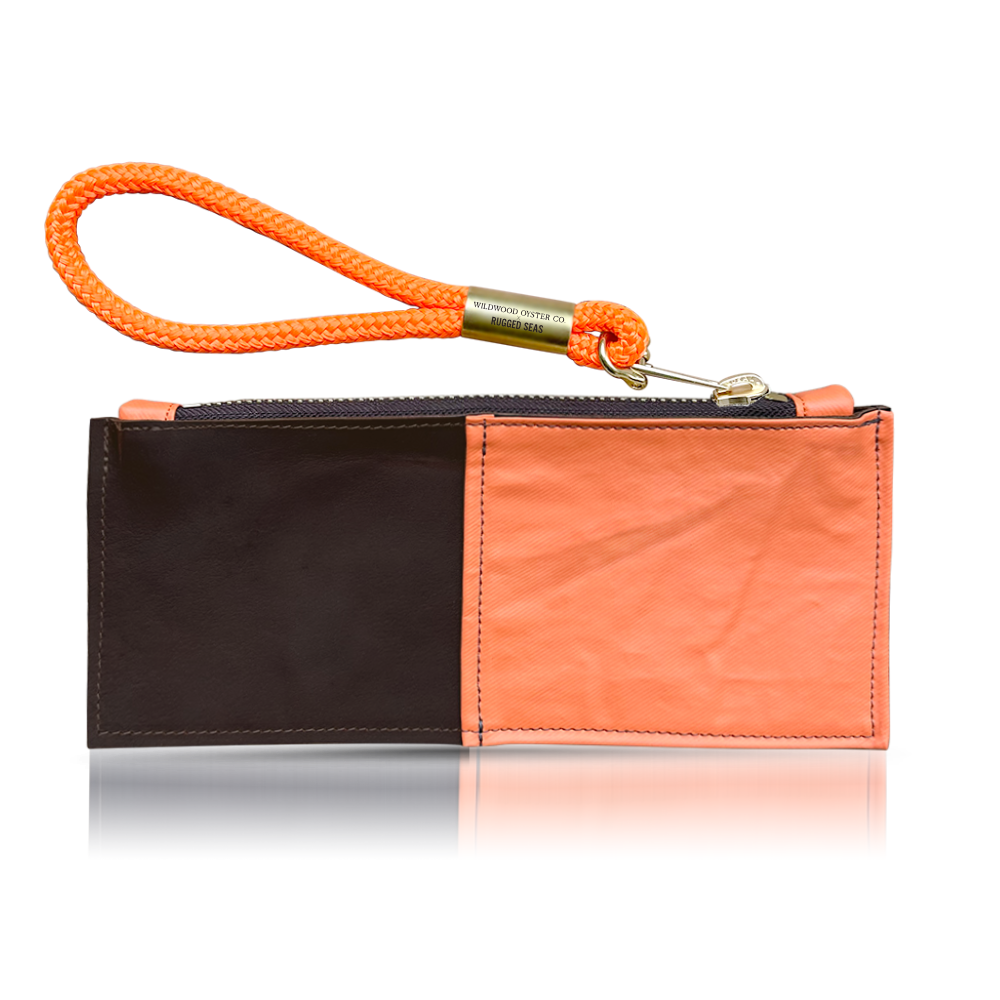 rugged seas clutch with neon orange wristlet