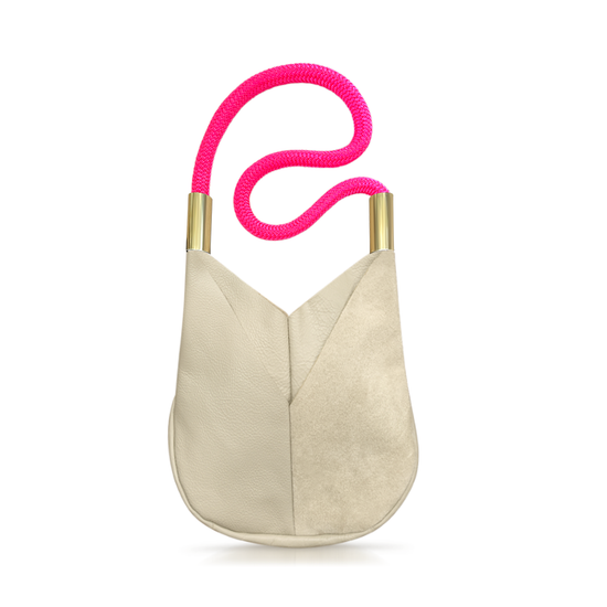 beige leather crossbody tote with neon pink dock line