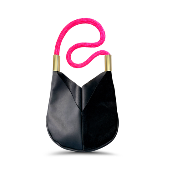 black leather crossbody tote with neon pink dock line