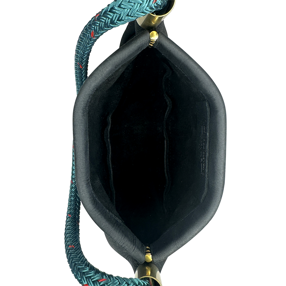 inside of black leather clam shell bag with teal dockline