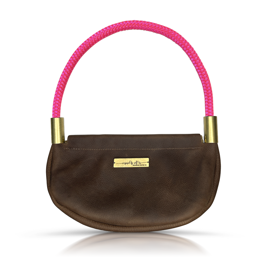 brown leather clam shell bag with neon pink dock line