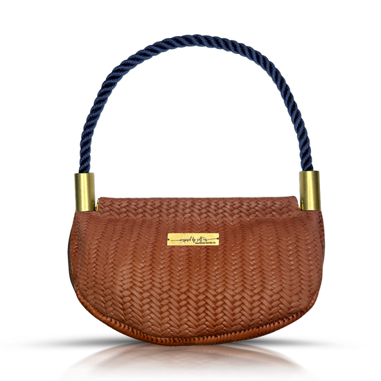 brown basketweave leather clamshell bag with navy dockline handle