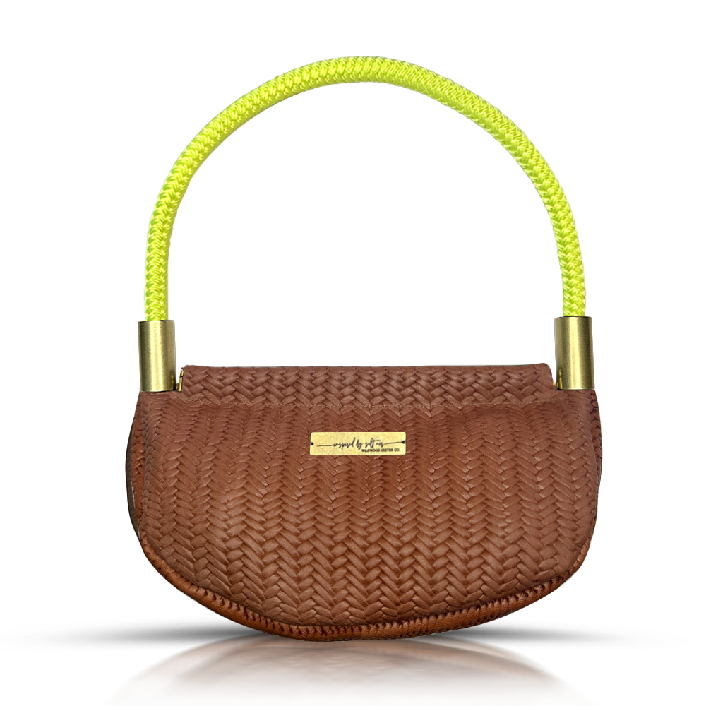 brown basketweave leather clamshell bag with neon yellow dockline handle