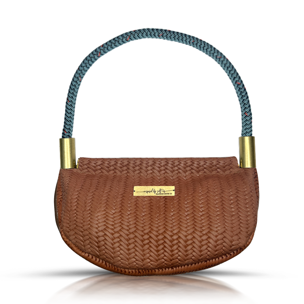 brown basketweave leather clamshell bag with teal dockline handle