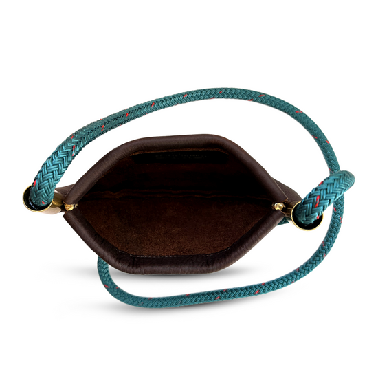 inside of brown leather oyster shell bag with teal dock line