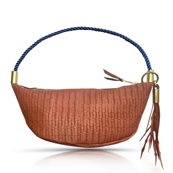brown basketweave sling bag with navy dock line handle