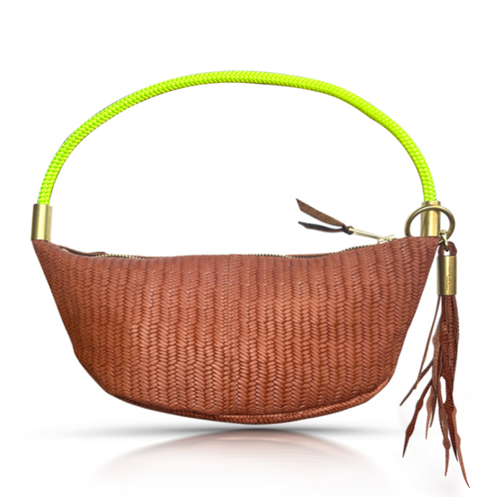brown basketweave sling bag with neon yellow dock line handle