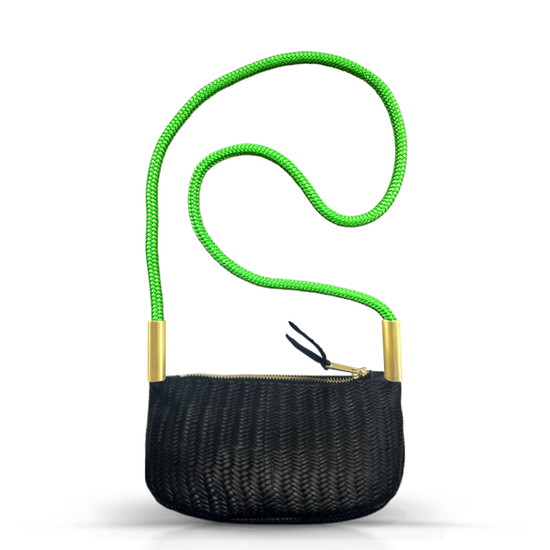 black basketweave leather zip crossbody tote with neon green dock line handle