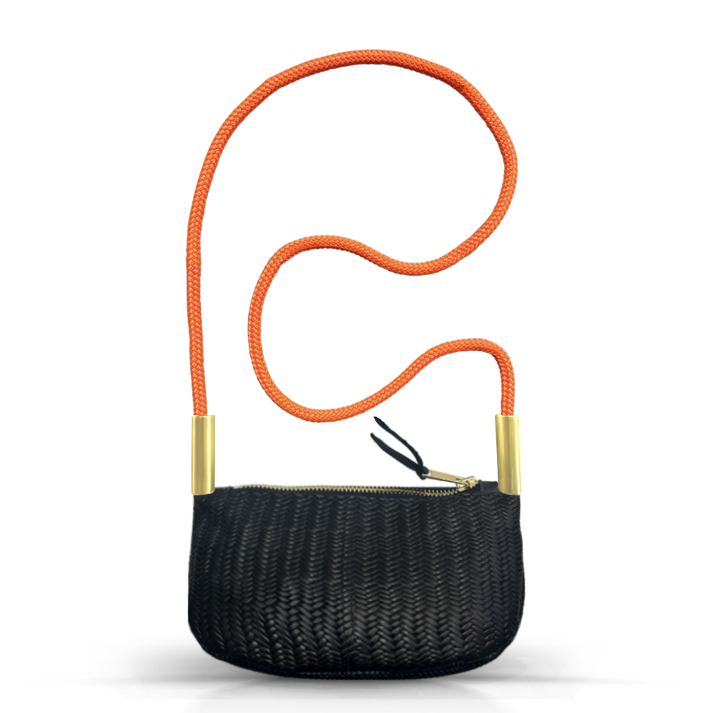 black basketweave leather zip crossbody tote with neon orange dock line handle