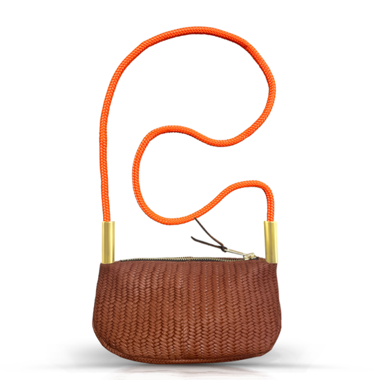 brown basketweave leather zip crossbody bag with neon orange dock line handle