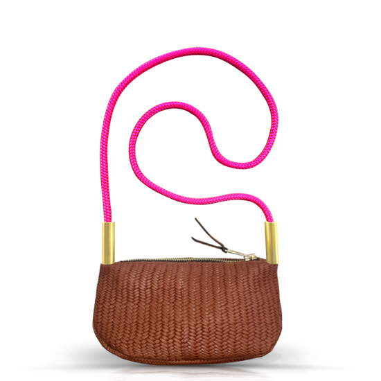 brown basketweave leather zip crossbody bag with neon pink dock line handle