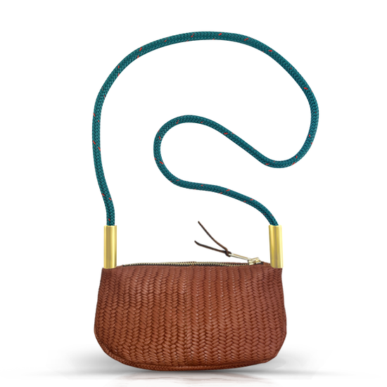 brown basketweave leather zip crossbody bag with teal dock line handle